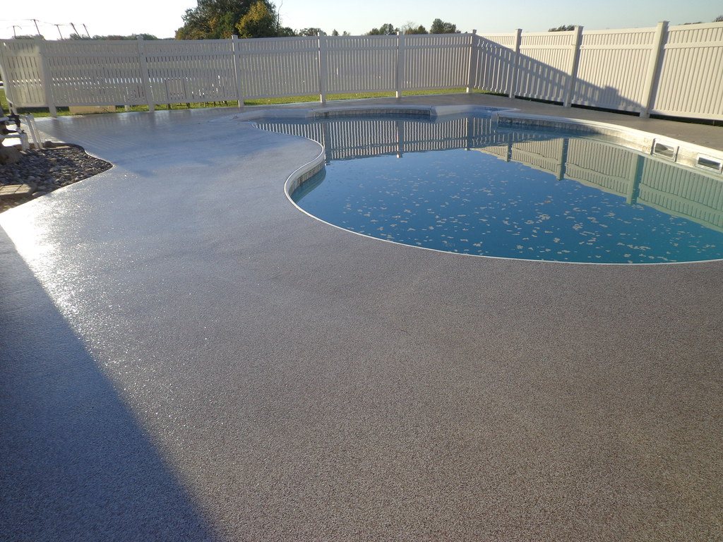 Exposed aggregate concrete pool surround
